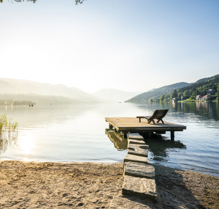 Lake Millstatt with loungers and jetty in Carinthia