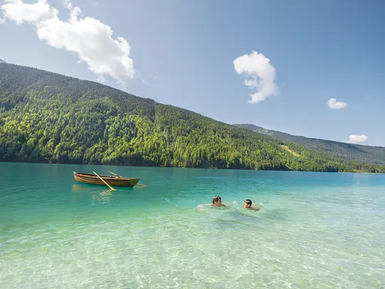 Swimming in Lake Weissensee with its blue waters (c) Edward Gröger. Swimming in Lake Weissensee with its blue waters (c) Edward Gröger.