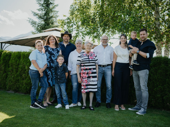 The Zerza family in the garden in front of the house.