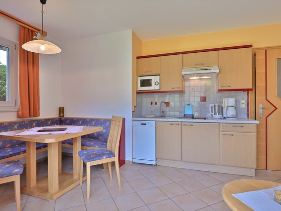 Dining area in the Family Apartment at Hotel Garni Zerza.