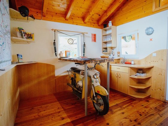Wooden motorcycle in the Bikerstüberl of the Hotel Garni Zerza.