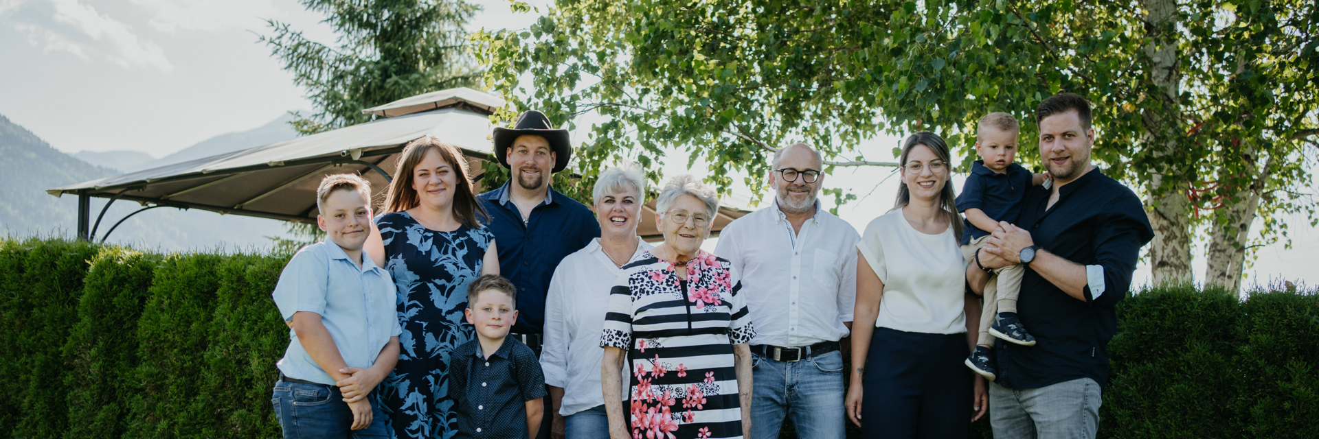 The Zerza family in the garden in front of the house.