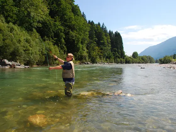 Fisherman in a lake at Nassfeld.