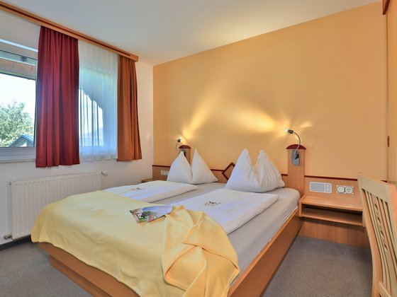 Double bed in the Family Apartment at Hotel Garni Zerza.